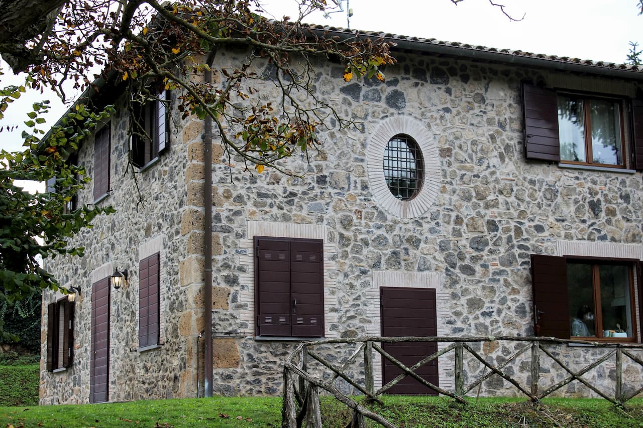 2-story stone cottage.