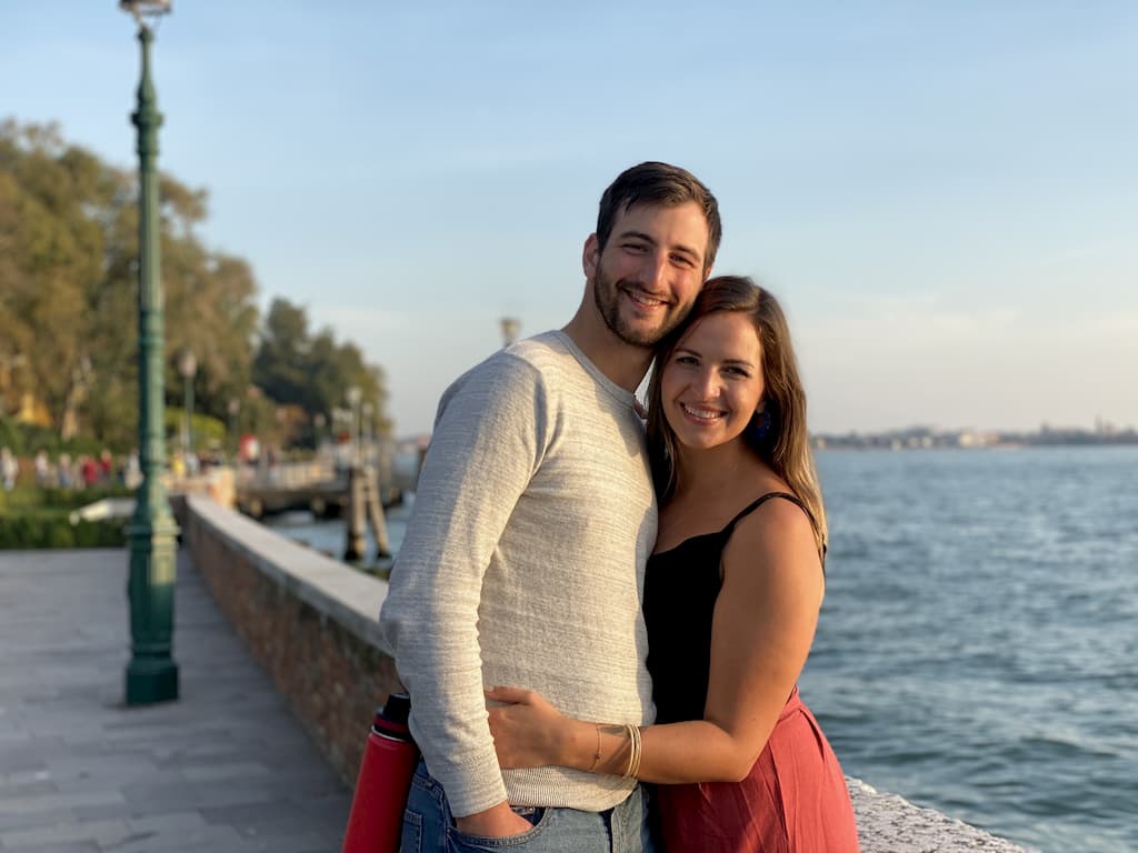 portrait of a man and woman near the water